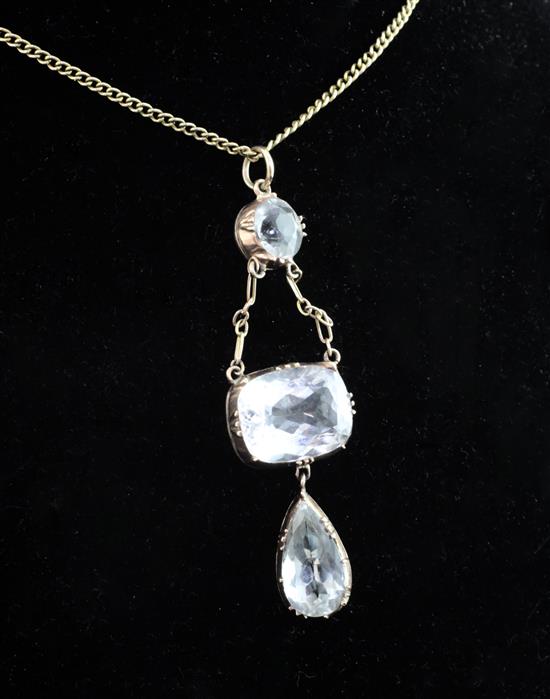 An Edwardian gold and pale aquamarine triple drop pendant, drop 2.25in.